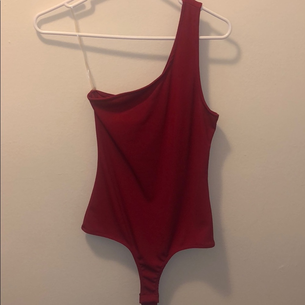Red one shoulder body suit
